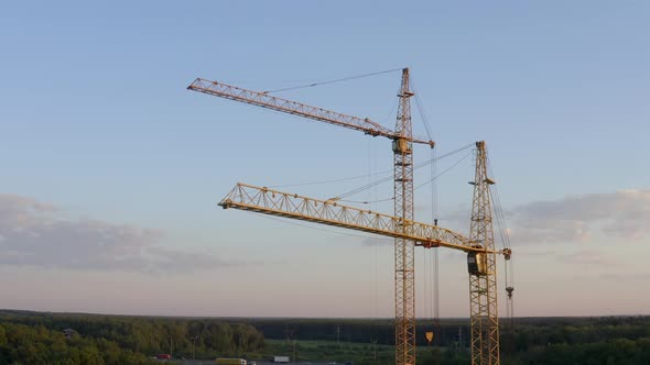 Aerial shot of tower cranes at construction site