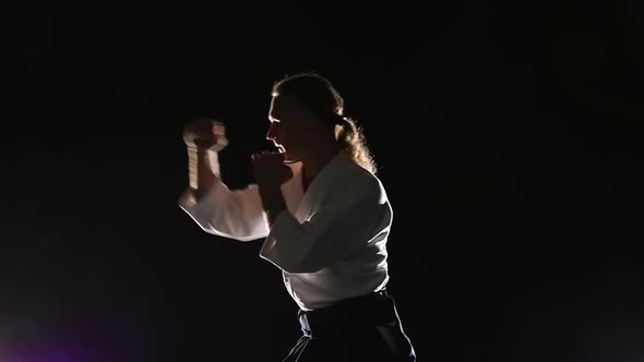 Master Martial Arts Aikido Training Isolated on Spotlights Background. Slow Motion. Close Up.