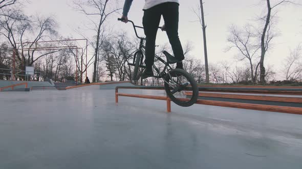 Bmx Rider Doing Tricks in Concrete Skatepark Slow Motion