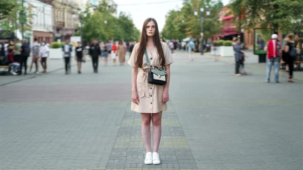 Time Lapse of Beautiful Female Student Standing Outdoors in Busy Street on Summer Day