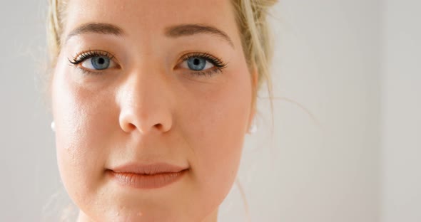 Woman looking at camera in fitness studio 4k