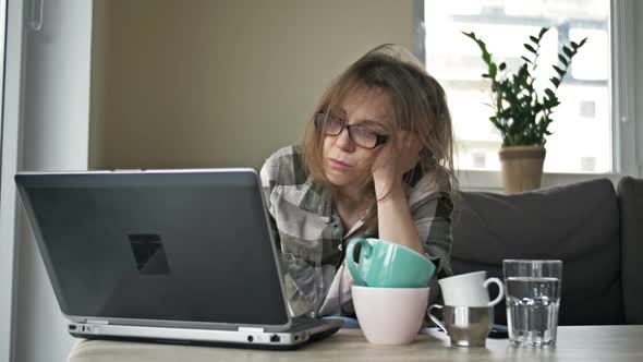 Very Tired Business Woman Working with Laptop at Home