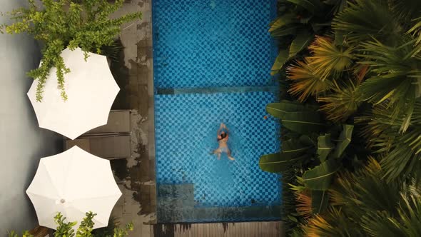 Girl Is Swimming in the Pool