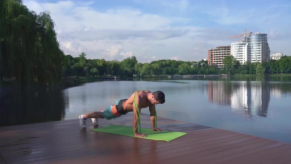 Athletic Guy with Bare Chest Doing Push Ups on Yoga Mat