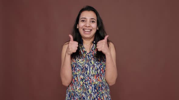 Indian Model Showing Okay Sign and Thumbs Up Gesture