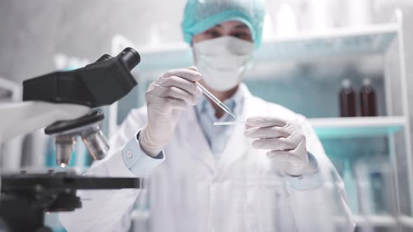 Researcher scientist using microscope to work in biotechnology laboratory medicine science biology