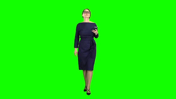 Girl Is Holding the Phone Dials the Message and Paces. Green Screen