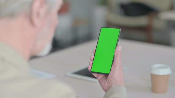 Old Man Using Smartphone with Green Screen