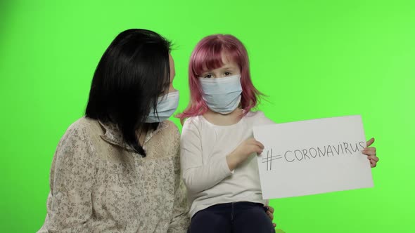 Sick Mother and Daughter in Mask Show Page with Message. Coronavirus Concept