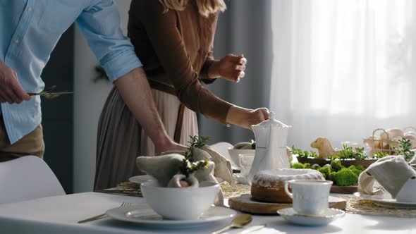 Caucasian family preparing  table for easter dinner. Shot with RED helium camera in 8K.