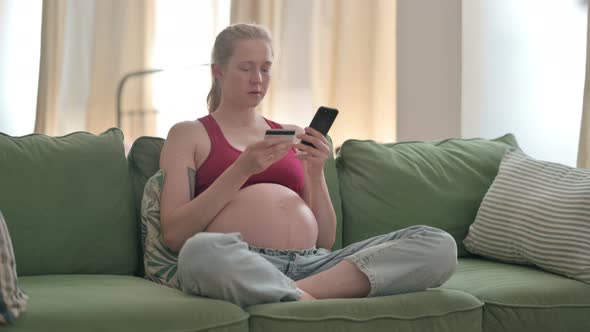 Pregnant Woman Shopping Online on Smartphone