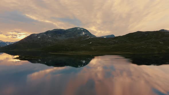 Beautiful Reflections Of Mountain And Sky In Vavatnet Lake During Sunset At Hydalen Valley, Hemsedal