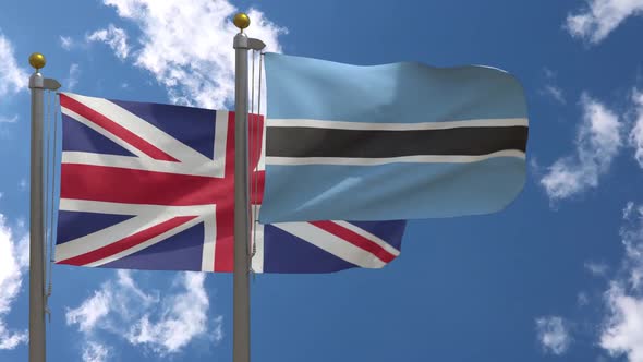 United Kingdom Flag Vs Botswana Flag On Flagpole