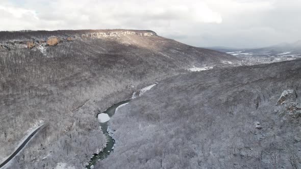 Aerial View of Plateau LagoNaki Mountain Twisted Road in the Winter and Driving Car