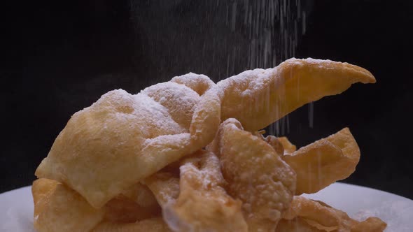 Sprinkling Angel Wings, Faworki With Powdered Sugar. - close up