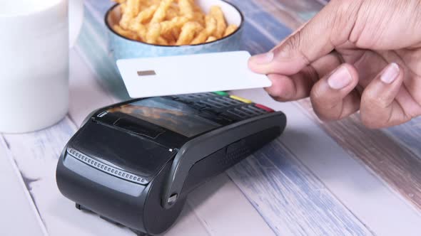 Payment Terminal Charging From a Card, Contactless Payment.