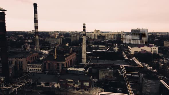 Aerial view of a drone flying over an industrial plant. Plant pipes