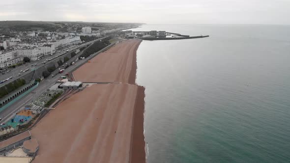 Aerial footage of Brighton and Hove town centre beach and coastal area showing the Brighton Marina