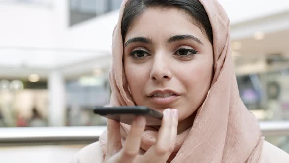 Young Muslim Woman Recording Voice Message
