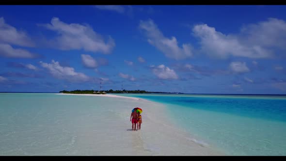 Man and woman suntan on exotic shore beach voyage by shallow water and white sandy background of the