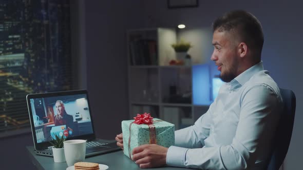 Two Multiracial Friends Making Video Call to Share Emotions From Unpacking Their Presents