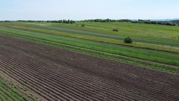 Aerial drone view of a flying over the rural agricultural landscape.