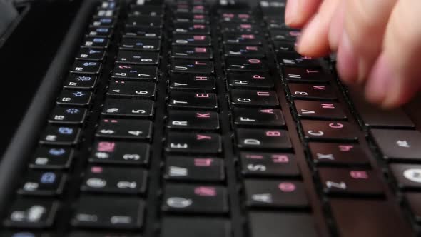 Both Hands of an Office Worker Typing on Black Keyboard, Close Up