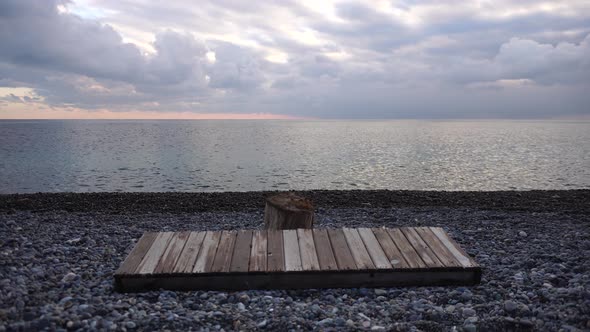 Empty Wooden Deckchair on the Beach