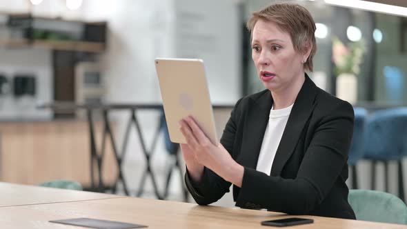 Disappointed Businesswoman Facing Loss on Tablet, Failure 