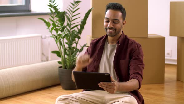 Man Having Video Call on Tablet Pc and Moving Home 41