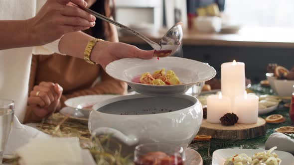 Close up of family sharing the Christmas soup. Shot with RED helium camera in 8K