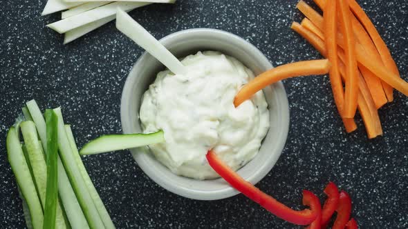 Vegetable sticks and dips in the bowl. Healthy vegetables and dip snack. 4K