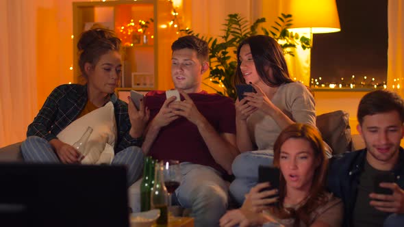 Friends with Smartphone Watching Tv at Home 24