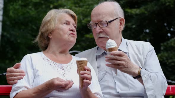 An Old Man on a Date with a Lady He Treats Her to Cold Ice Cream
