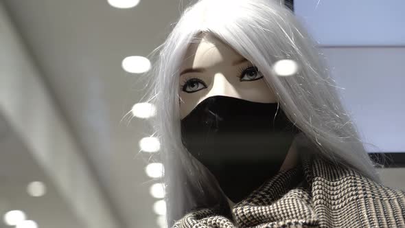 Mannequin in Protective Mask with Scarf in Fashion Store