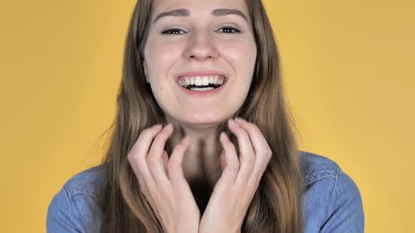 Close Up of Excited Amazed Woman in Surprise Isolated on Yellow Background