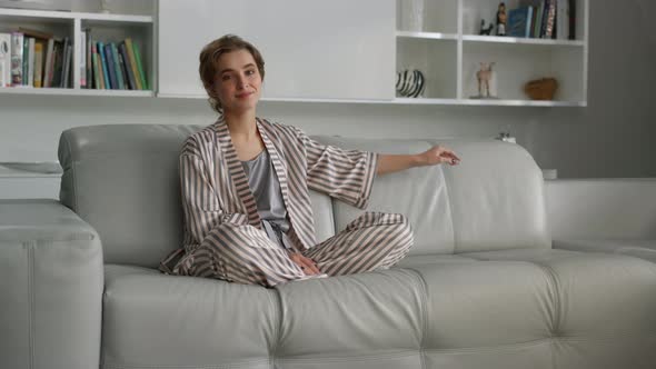 Beautiful Housewife Posing Sofa in Pajamas Before Breakfast