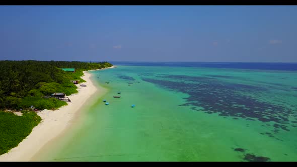 Aerial top down landscape of marine lagoon beach lifestyle by shallow ocean and white sandy backgrou