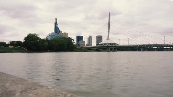 Time-lapse of river in front of a city skyline - Winnipeg