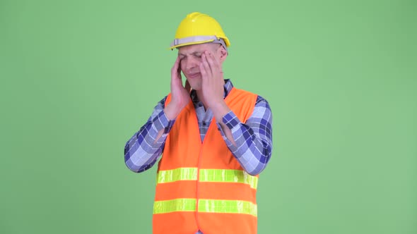 Stressed Young Man Construction Worker Having Headache