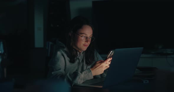 Authentic Young Woman Work on Laptop at Dark Home