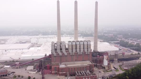 The Otto Eckert Power Station Facing Grand River At Misty Morning In Lansing Michigan, USA. - Aerial