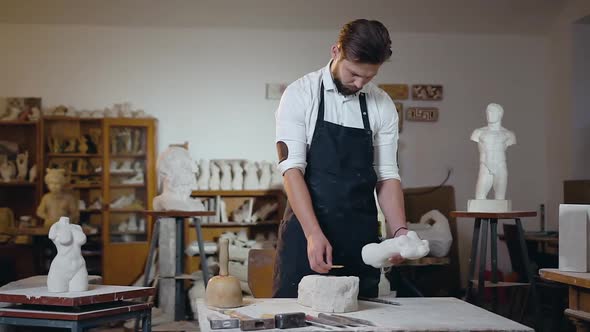Bearded Male Master which Working with Original and Future Sculptures in the Craft Studio