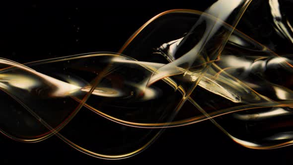 Super Slow Motion Shot of Swirling and Splashing Golden Oil Isolated on Black Background at 1000Fps.