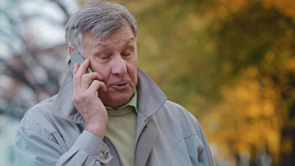 Portrait Mature Elderly Man Pensioner Communicate Remotely Using Modern Smartphone Talking Family or