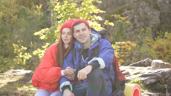Lovely Caucasian Couple Is Enjoying Time on Mountains.