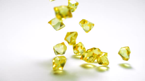 Dropping colorful acrylic stone, Slow Motion alt