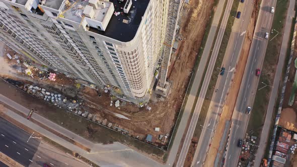 Aerial Top Down View Construction with Yellow Tower Crane Working on Building Site