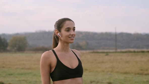 Girl Doing Yoga Exercises Outdoors.