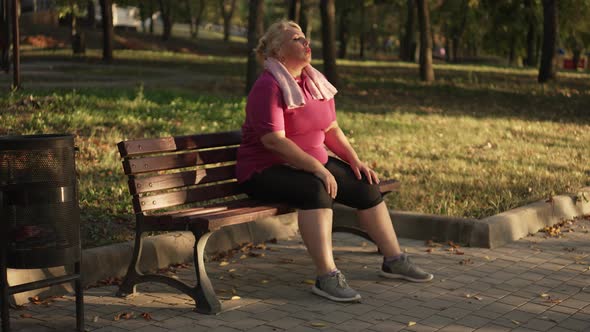 Overweight Woman Resting After Running